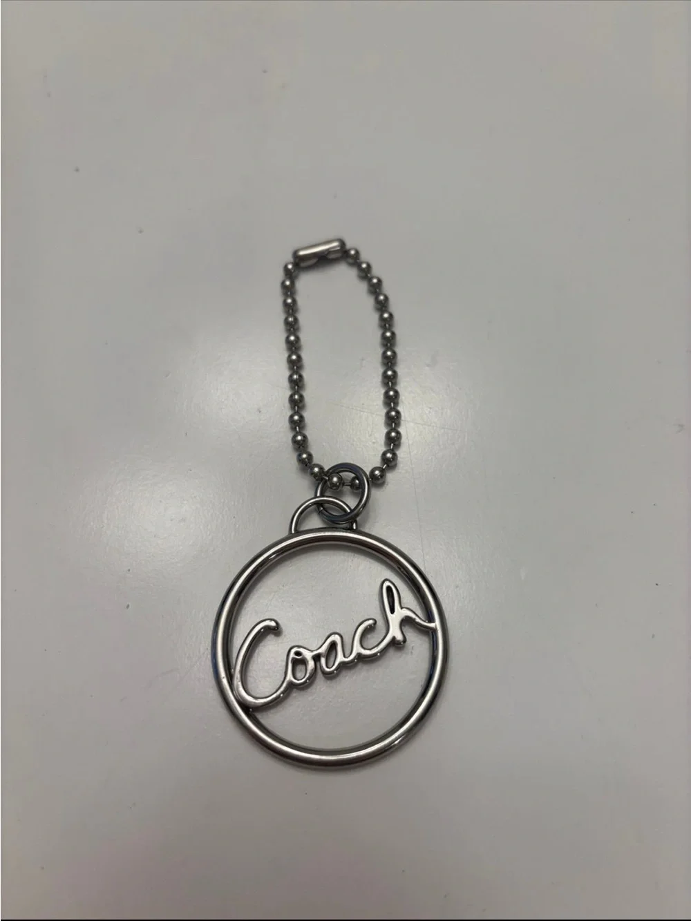 Coach Silver Script Circle Keychain